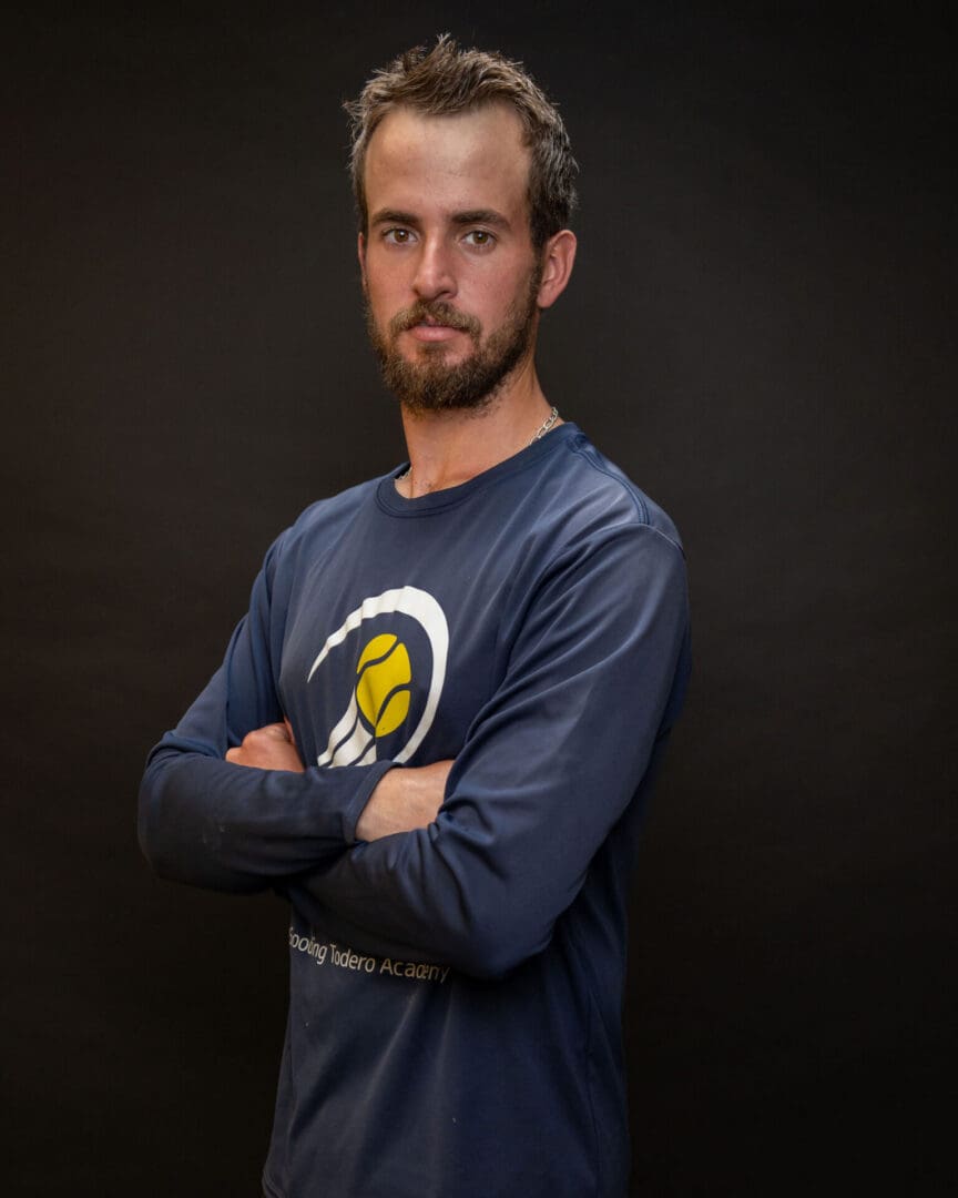 Bearded man with arms crossed